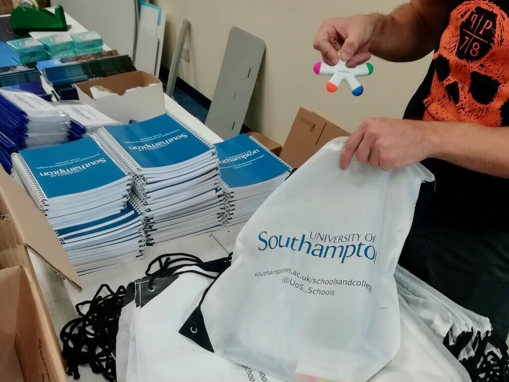 A worker packing up the activity packs